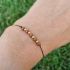 Náramek ZLATÝ GOLDSTONE šňůrkový 4mm GOLD